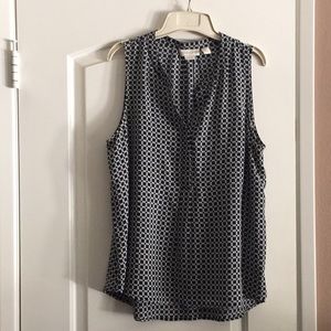 Sleeveless black and white blouse